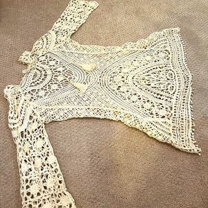 Two crocheted swim suit cover ups